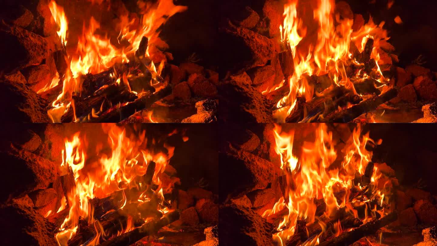 大燃烧的营火，炽热的火焰，燃烧的木棍和原木，森林和自然露营之旅，4K拍摄