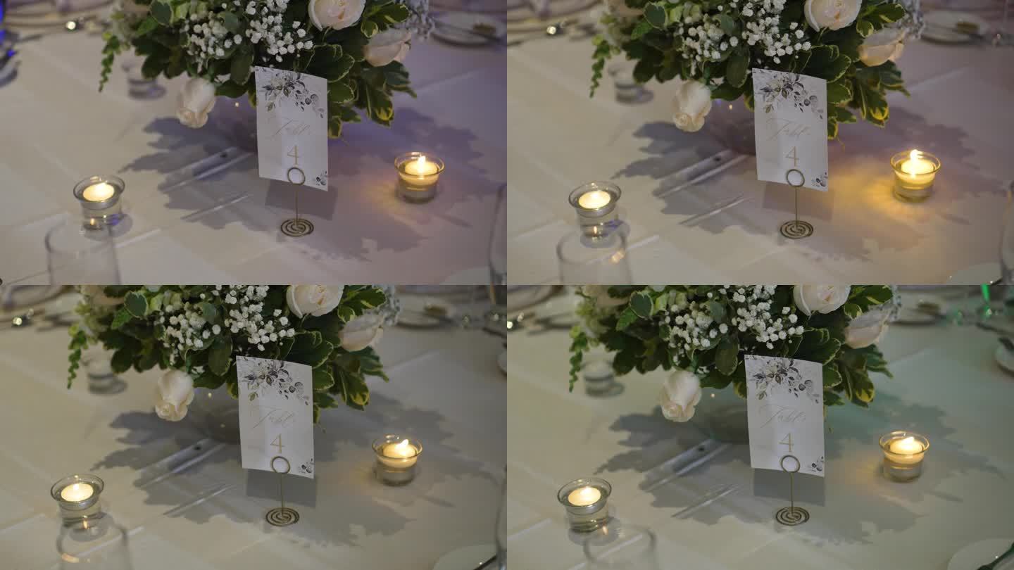婚礼宴席上的插花和桌子分配卡。