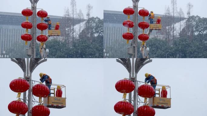 成都雪天给路灯挂灯笼的工人