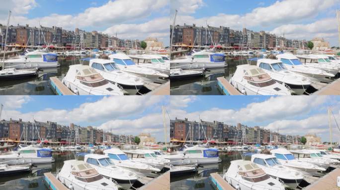港口有游艇，泊位有船只。停泊在码头码头附近的游艇。放眼望去，停车场的小船、轮船、游艇在蓝天的衬托下穿