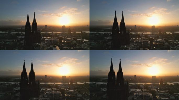 鸟瞰实时镜头飞过科隆大教堂，科隆中央车站，音乐圆顶和霍亨索伦桥在日出时间在科隆市中心，德国