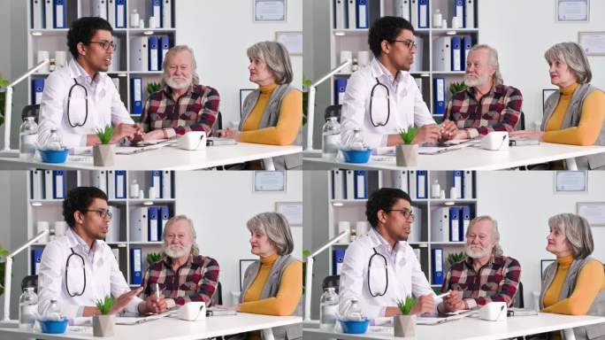 保健，一位老人和他的妻子在黑人医生的体检中用血压计测量血压