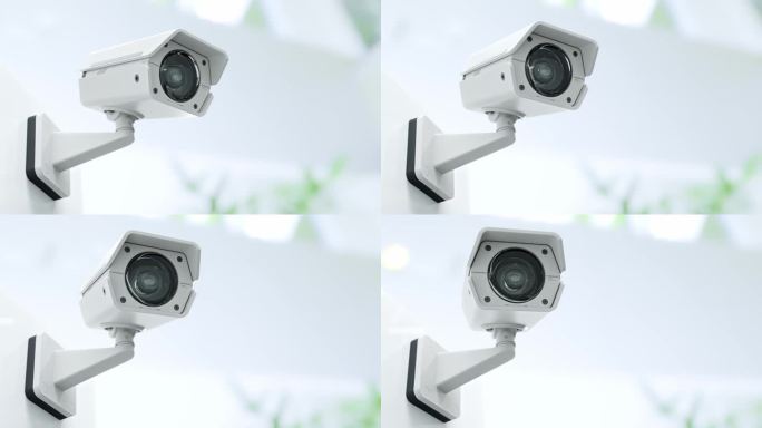 闭路电视摄像机安装在大楼的墙上。扫描该区域以进行监视。可以在保安工作中后台使用。