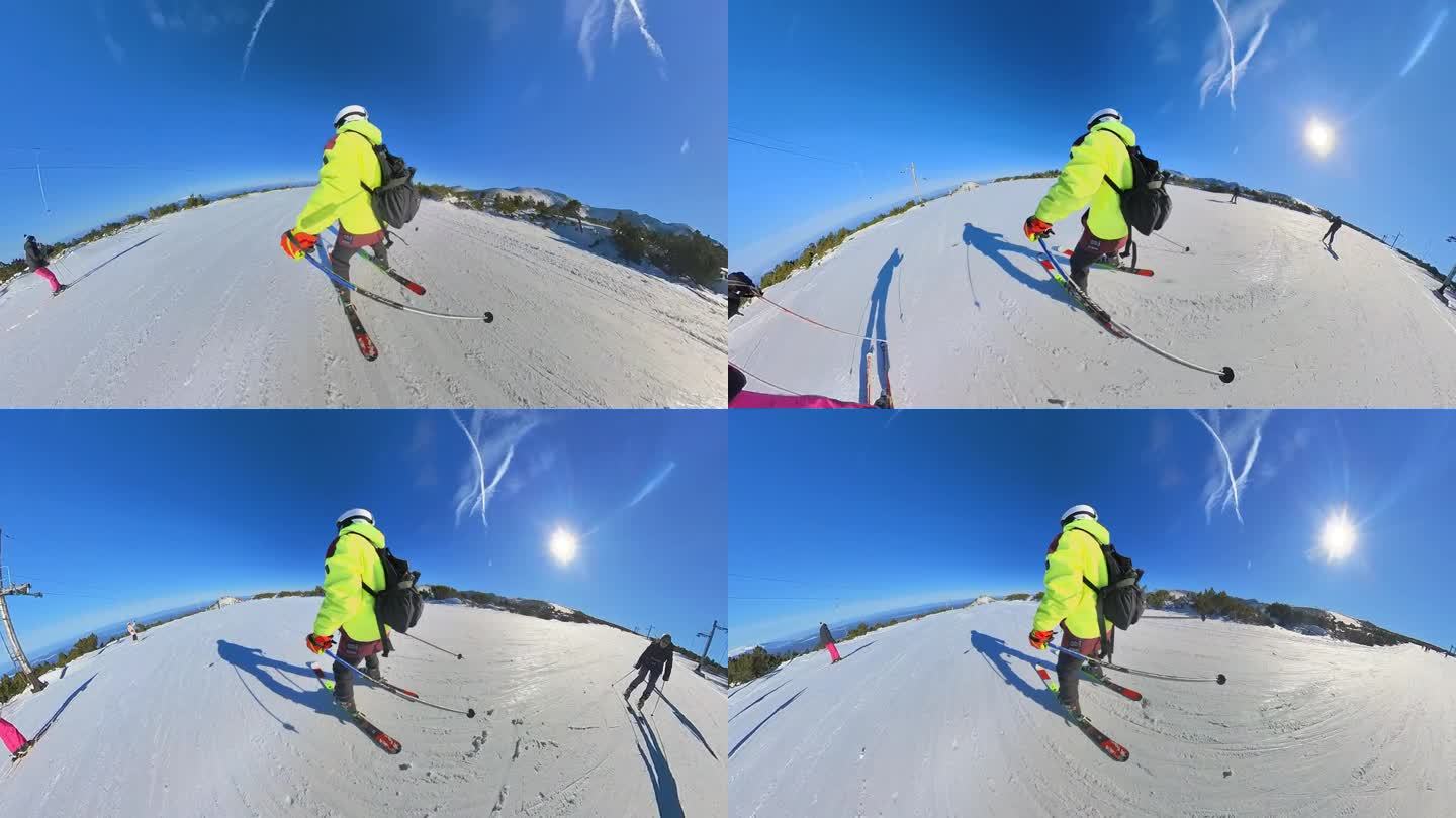 年轻的业余女子滑雪下山。