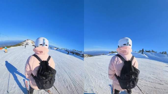 年轻的业余女子滑雪下山。