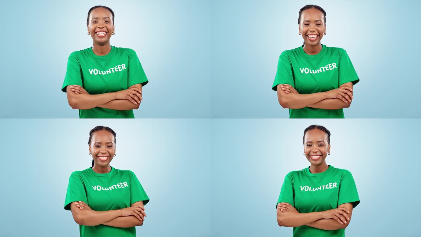 黑人女性志愿者，肖像中双臂交叉，蓝色背景是慈善与社会责任的帮助。社区服务，为专业非营利组织捐款和支持
