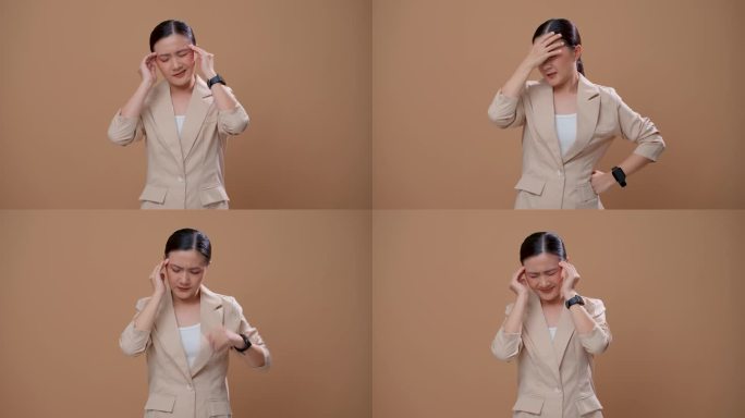 一名亚洲妇女患头痛，独自站在米色背景上。