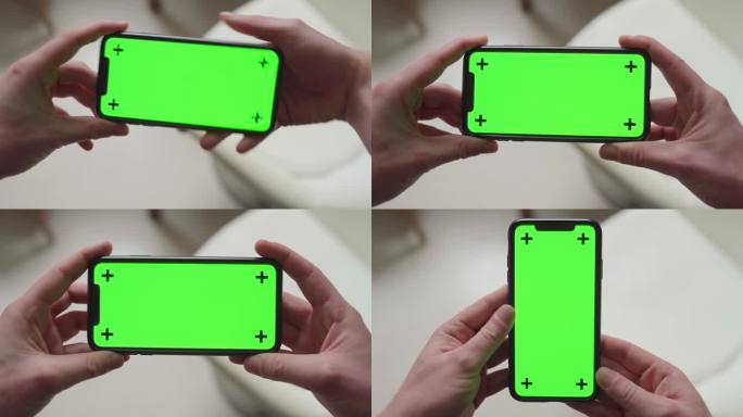 双手握住智能手机，绿色屏幕显示和跟踪标记，从横向到纵向再到横向再回到纵向