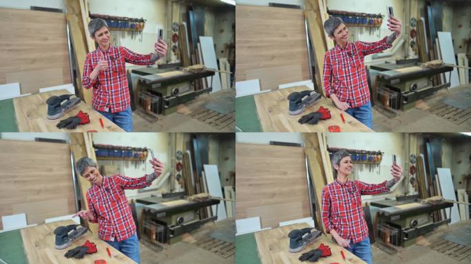 木工车间的女木匠用手机拍视频