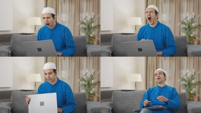 疲惫的穆斯林男子在使用笔记本电脑