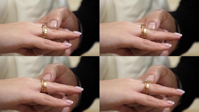 新郎把结婚戒指戴在新娘的手指上。爱情和浪漫关系。