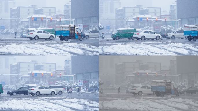 雪中十字路口车辆行驶