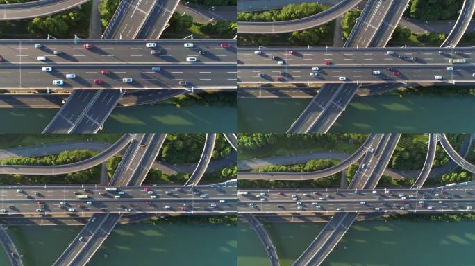 航拍无人机的高速公路多层次路口道路与移动的汽车在日落。运输车辆主动向不同方向移动。中国。自顶向下视图