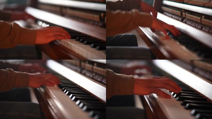 人的手弹钢琴的特写。上钢琴课并练习