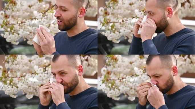男士春季季节性过敏，打喷嚏，用手绢擤鼻涕。
