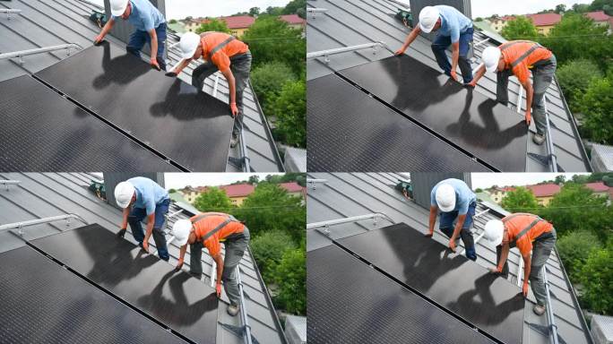 工人们在屋顶上建造太阳能电池板系统。安装光伏太阳能组件的工人