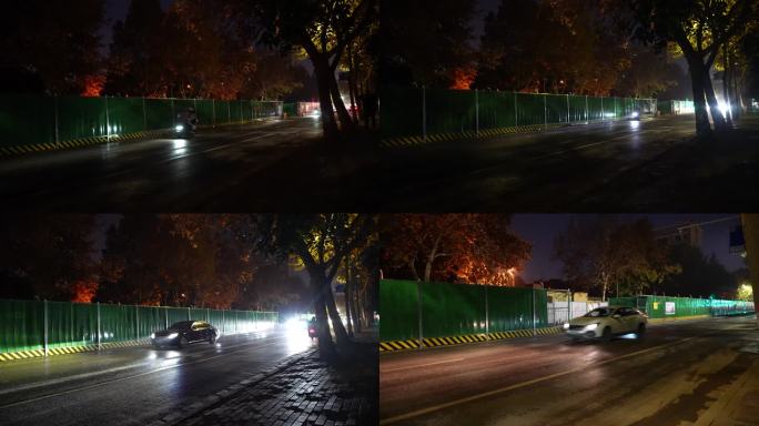 夜间道路施工围挡行人汽车行驶路上晚上街道