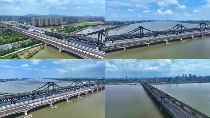高铁火车驶过城市跨江大桥航拍