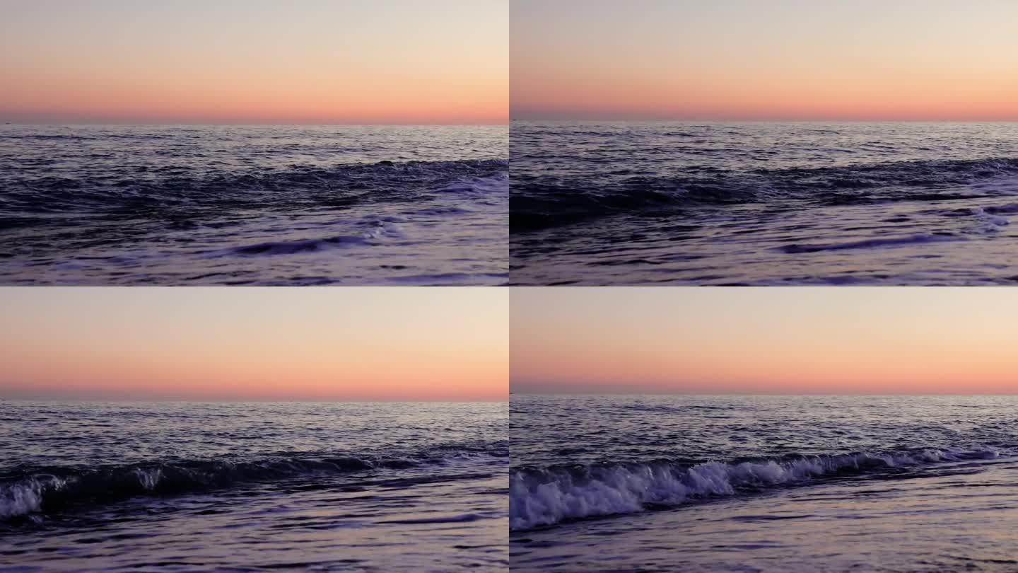 日落时分，一波又一波涌上沙滩。每一波都捕捉到了宁静海滩夜晚的精髓。日落的场景，有节奏的海浪拥抱着海滩