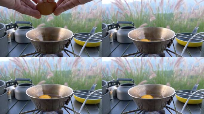 特写镜头:一只手在煎锅里打鸡蛋。