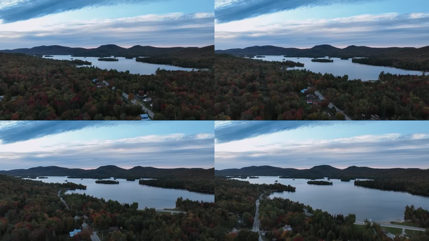 黄昏时分，纽约汉密尔顿县蓝山湖周围的秋叶。空中