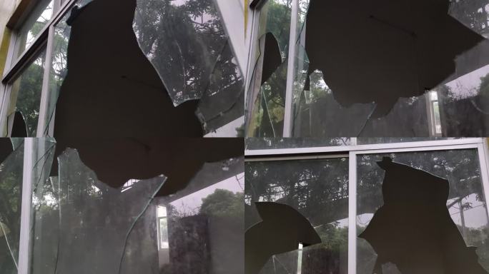 房子窗户玻璃破碎击碎击穿玻璃碎片玻璃爆破