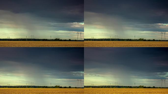 暴雨和乌云横跨金色的麦田。间隔拍摄