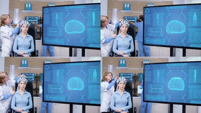 戴着脑部扫描仪的女性在电视屏幕上的脑部活动