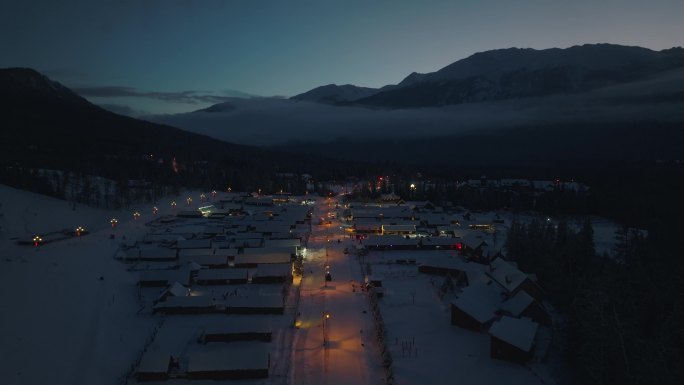 航拍冬季雪后新疆喀纳斯乡村夜景