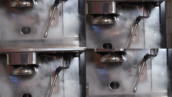 一名男子打开咖啡机上的蒸发器，蒸汽被倒入一个滴漏盘。