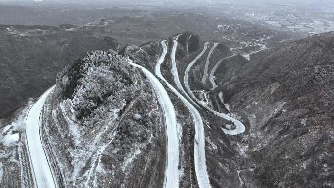 山区冬季盘山公路雪景航拍