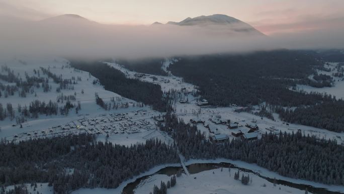 航拍清晨的新疆喀纳斯雪景