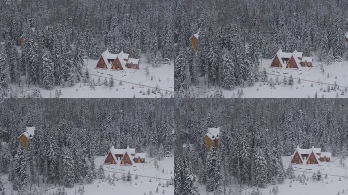 航拍下雪天新疆喀纳斯林中木屋