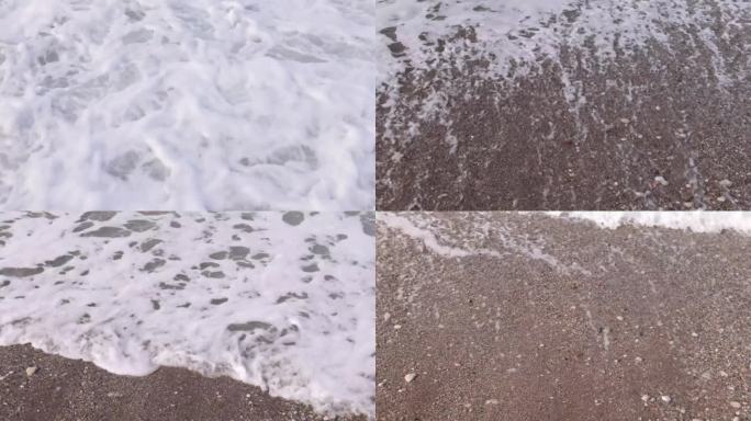 靠近海岸的波浪与泡沫特写。前视图。风大浪急的海面