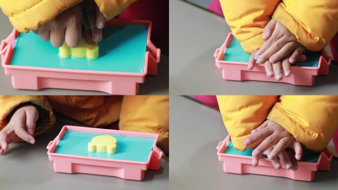盖上盖板用双手压盖板的儿童 幼儿手工