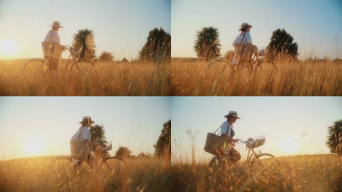 骑自行车和肩包的女子走在草地上