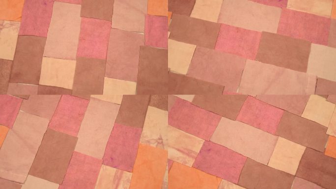 色彩丰富的复古纺织品背景与面料元素在粉红色和棕色色调，背景
