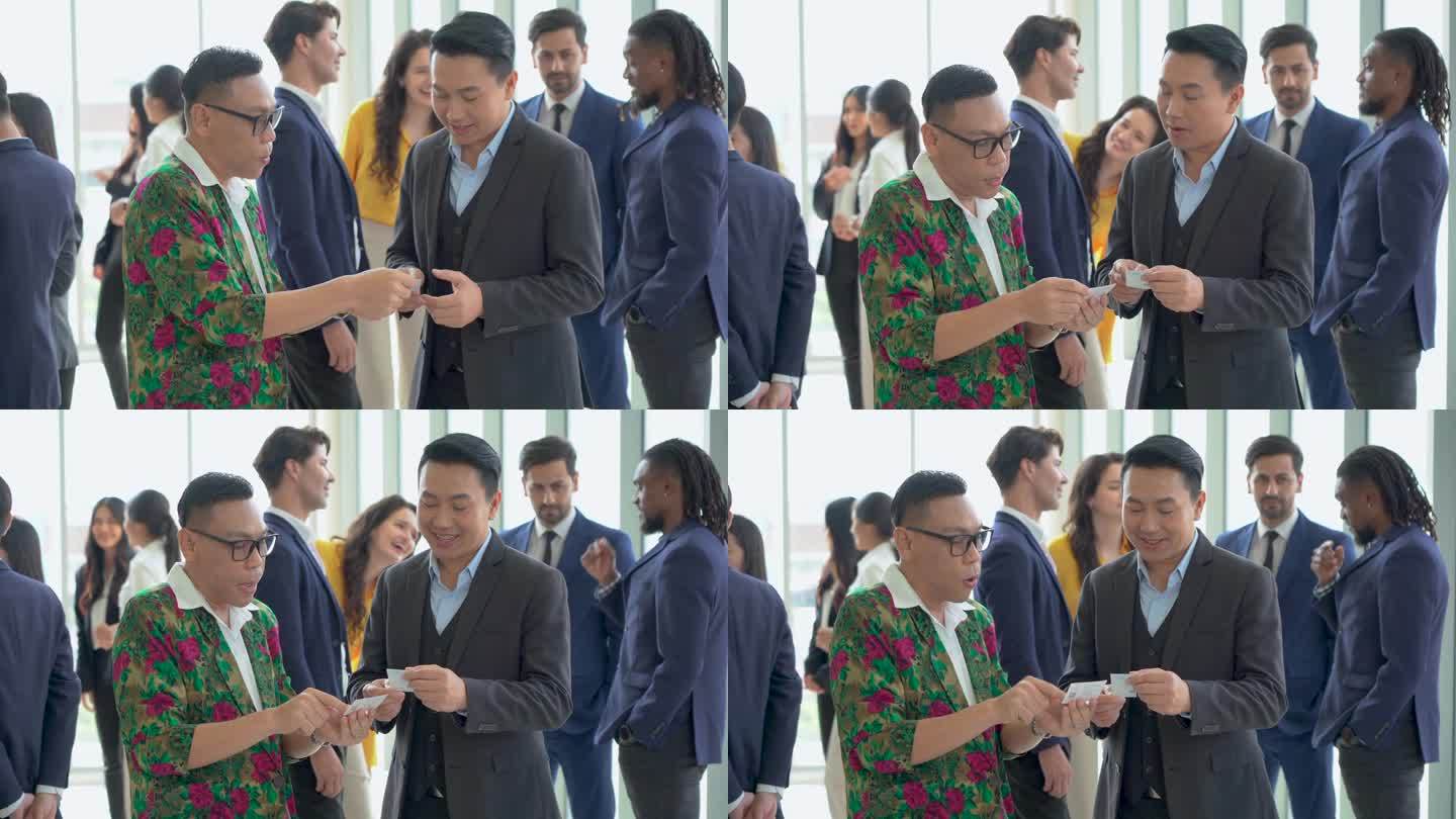 一群不同类型的商务人士在会议或研讨会结束后互相握手问候，交换名片。公司办公室沟通。连接的人。亚洲