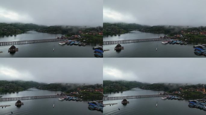 蒙桥的神秘黎明:历史上被雾覆盖的跨度与河上的船-空中视角。