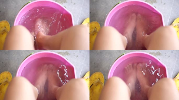 亚洲女人把脚放在温水里放松