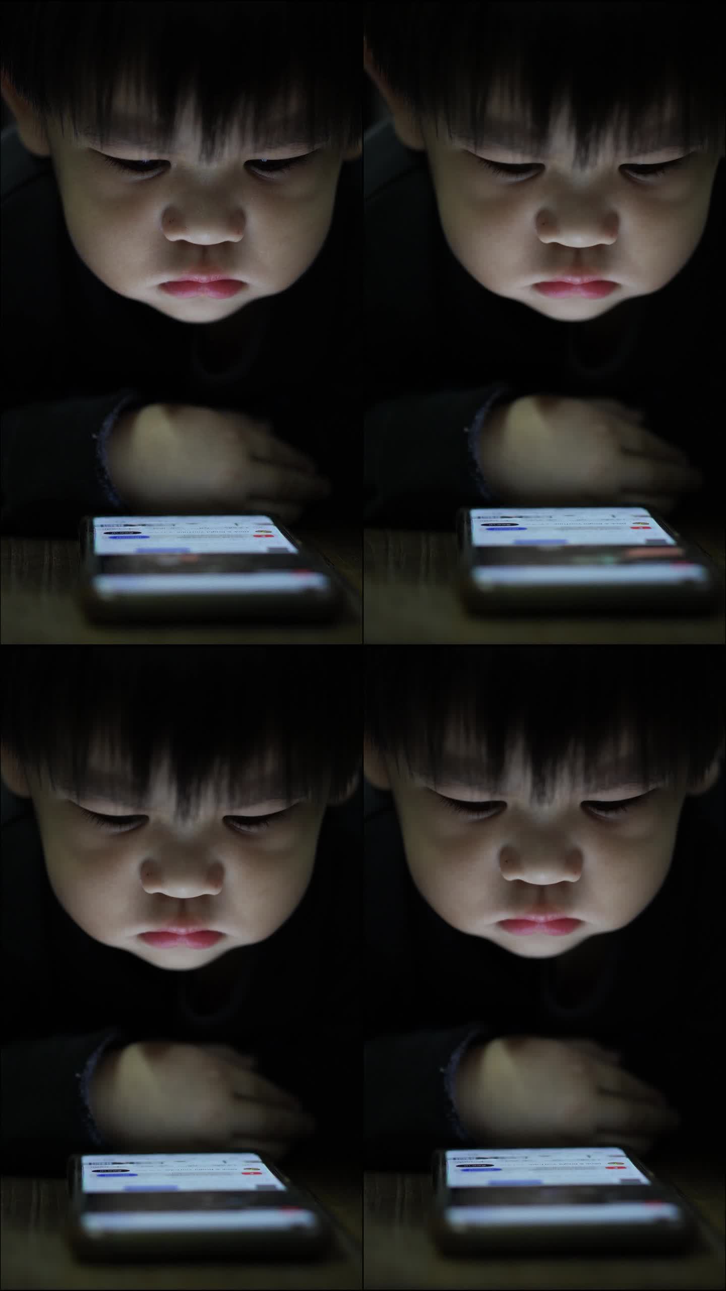孩子在看智能手机竖屏数字技术家长监控