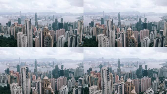 香港鸟瞰中国城市的都市风貌。全景式交通道路与早晨港口交通。拥挤的香港名镇中心的贸易经济观念