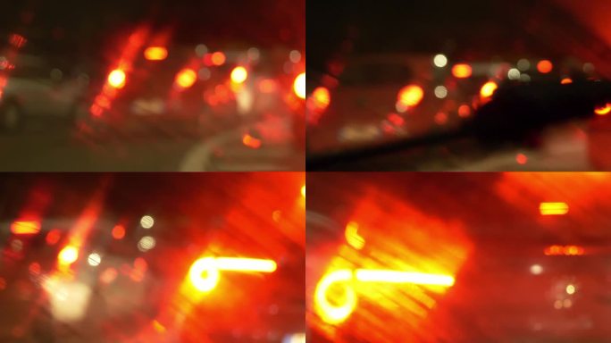 通过熙熙攘攘的交通，闪亮的前灯和繁忙的城市街道上有节奏的信号的镜头捕捉到的晚高峰时间。