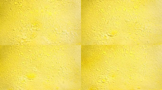 以1000帧/秒的速度拍摄冒泡的黄色柠檬水抽象背景。