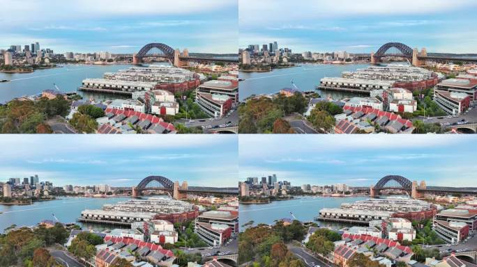 澳大利亚悉尼:澳大利亚新南威尔士州首府悉尼海港大桥的鸟瞰图，北悉尼商业区在地平线上