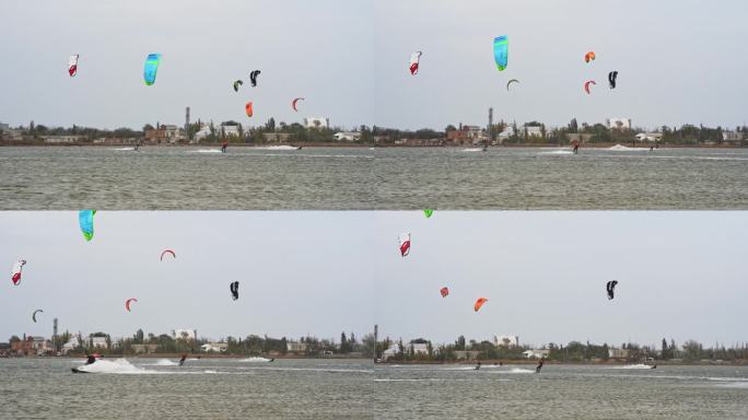 风筝板运动员利用风力，在波浪上滑行，在暴风雨的大海背景下。极限运动爱好者在波涛汹涌的水面上表演空中特