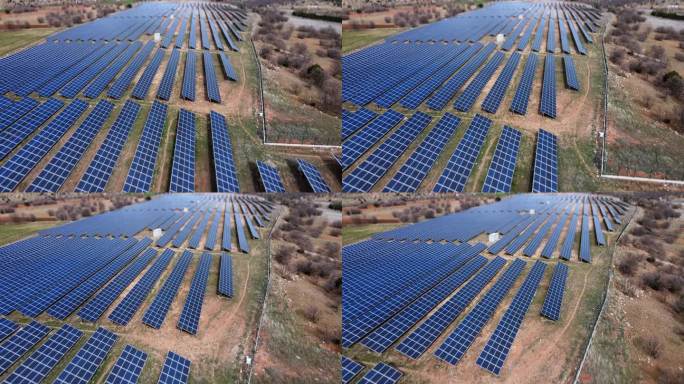太阳能电池板大规模阵列产生可再生能源。可持续能源和资源背景。无人机航拍图