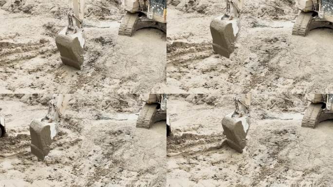 挖土机在工地脏泥面作业