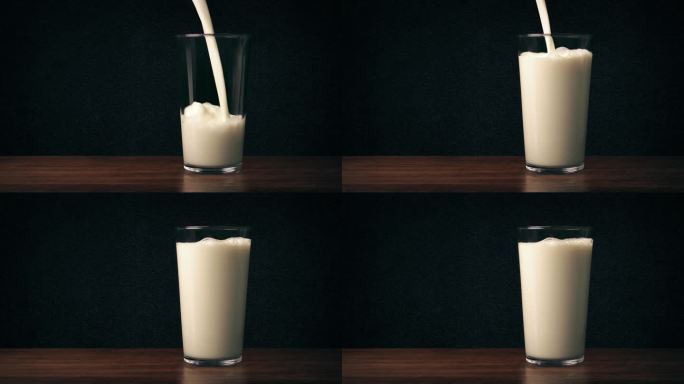 牛奶倒在桌子上的玻璃杯里