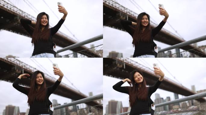 中国女孩游览纽约，在布鲁克林大桥下自拍